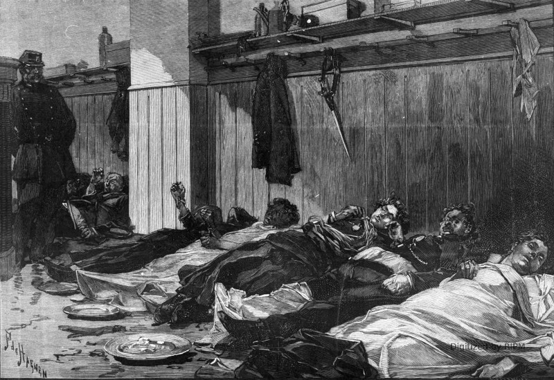Incendie de l’Opéra-Comique. — Les cadavres des victimes déposés dans une des salles du poste de la mairie du IXe arrondissement, rue Drouot.